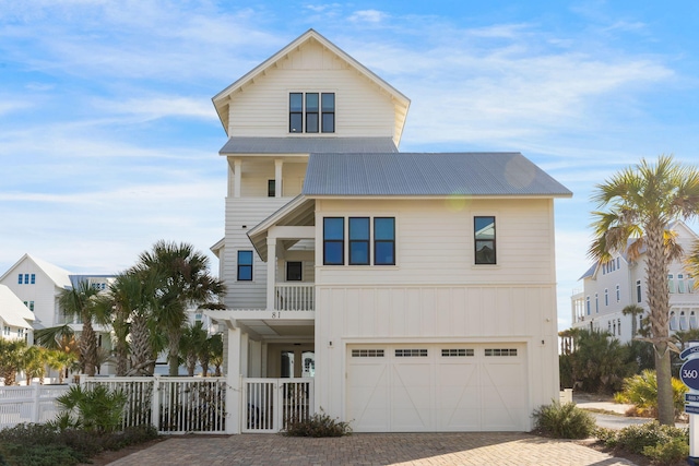 view of front facade with a balcony and a garage