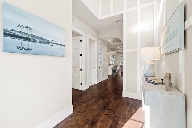 corridor featuring dark hardwood / wood-style floors