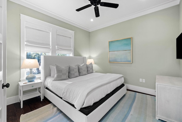 bedroom with ceiling fan, ornamental molding, and dark hardwood / wood-style floors