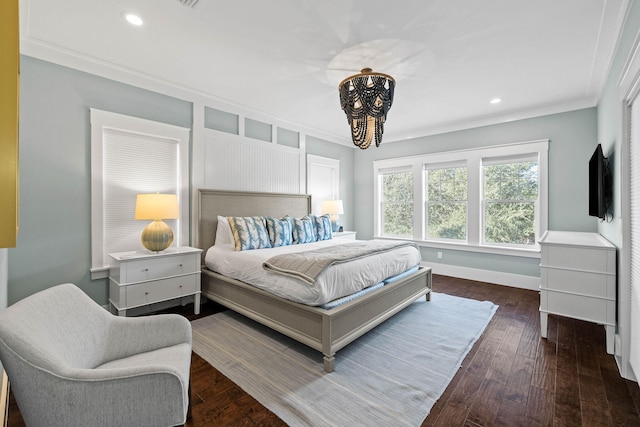 bedroom with a notable chandelier, crown molding, and dark hardwood / wood-style floors