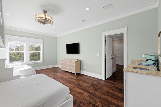 bedroom with crown molding, sink, and dark hardwood / wood-style floors