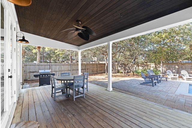 deck with ceiling fan and area for grilling