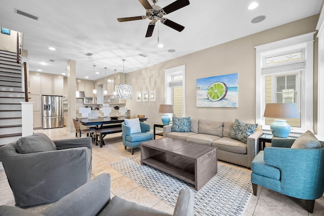 tiled living room featuring ceiling fan