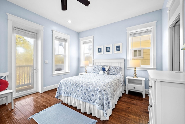 bedroom featuring dark hardwood / wood-style floors, access to outside, and ceiling fan