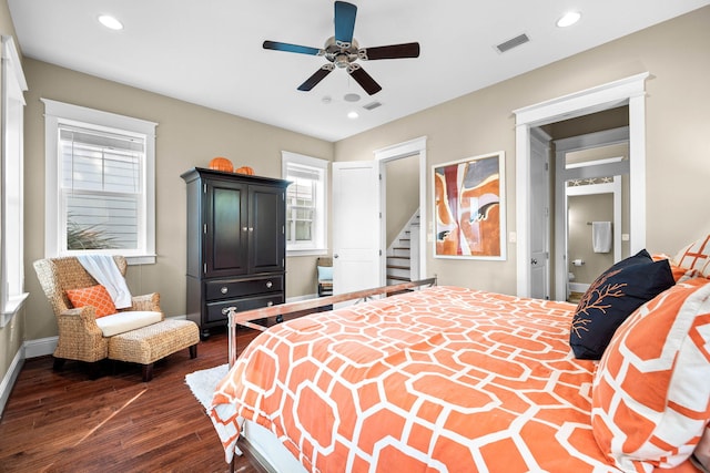 bedroom with dark hardwood / wood-style floors and ceiling fan