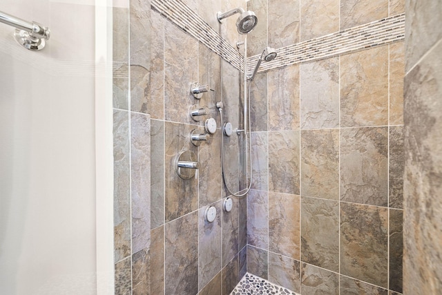 bathroom with a tile shower