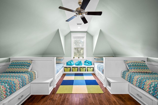 bedroom featuring ceiling fan, dark hardwood / wood-style floors, and vaulted ceiling