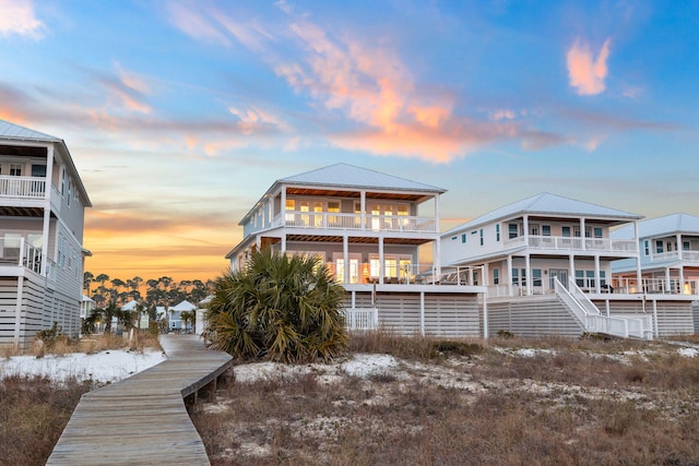 view of back house at dusk