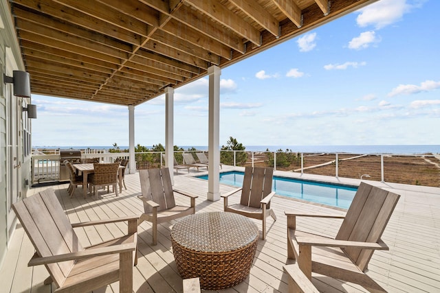 deck featuring a fenced in pool