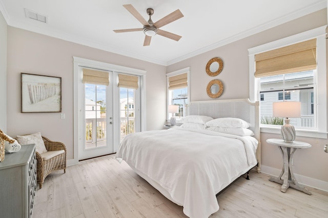 bedroom with ornamental molding, access to exterior, light hardwood / wood-style floors, and french doors