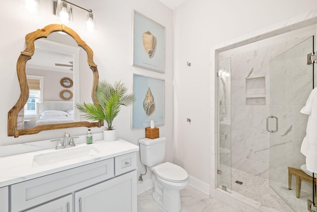 bathroom featuring toilet, vanity, and walk in shower