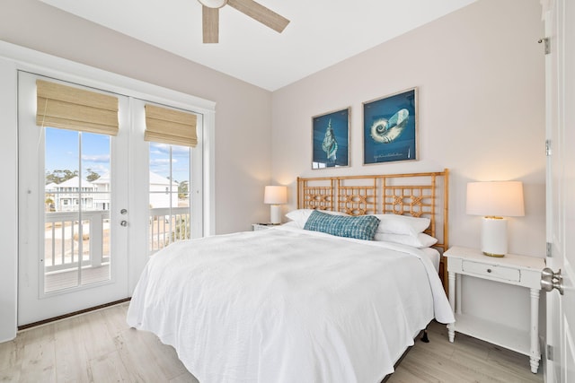 bedroom featuring light hardwood / wood-style flooring, access to outside, french doors, and ceiling fan