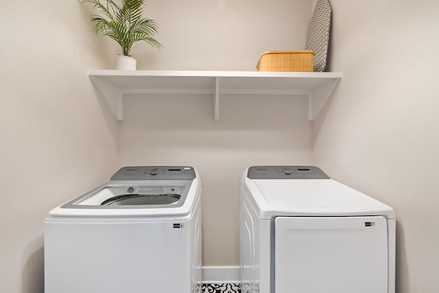 clothes washing area with washer and dryer