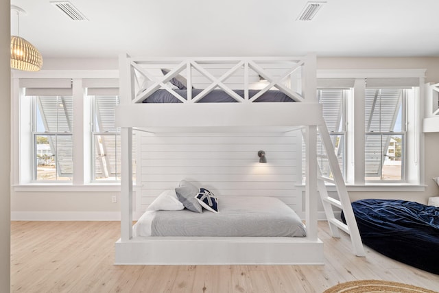 bedroom with wood-type flooring