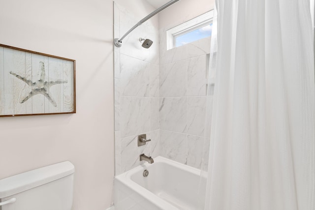 bathroom with toilet and shower / bath combo with shower curtain