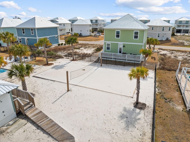 back of house featuring volleyball court and central AC unit