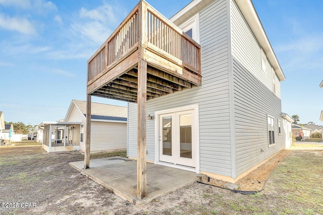 back of house with a patio and french doors