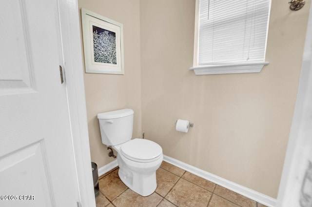 bathroom featuring tile patterned floors and toilet