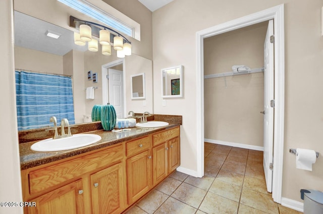 bathroom with vanity and tile patterned flooring