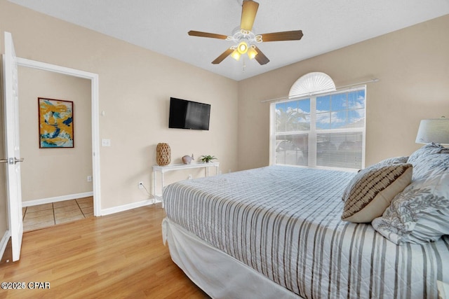 bedroom featuring hardwood / wood-style flooring and ceiling fan