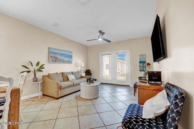 tiled living room with ceiling fan