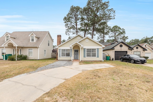 view of front of house featuring a garage and a front yard