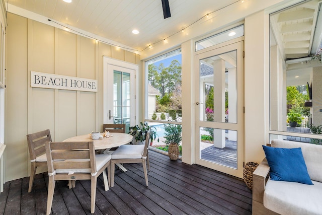 sunroom / solarium featuring wood ceiling