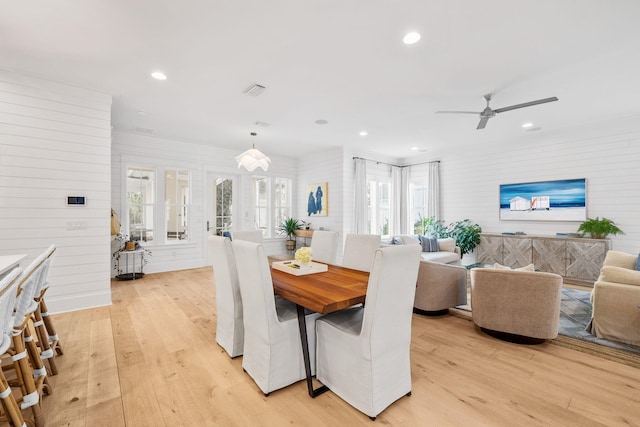 dining space with light hardwood / wood-style floors