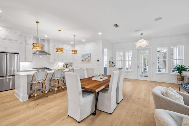 dining room with light hardwood / wood-style flooring