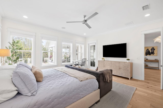 bedroom featuring crown molding, ceiling fan, and light wood-type flooring