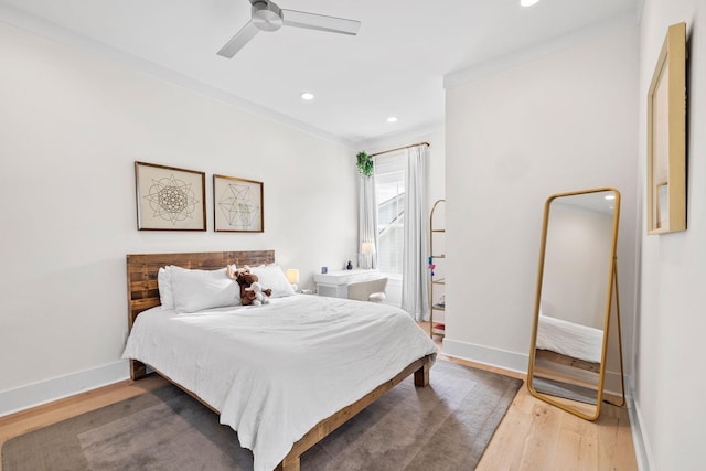 bedroom with hardwood / wood-style flooring and ceiling fan