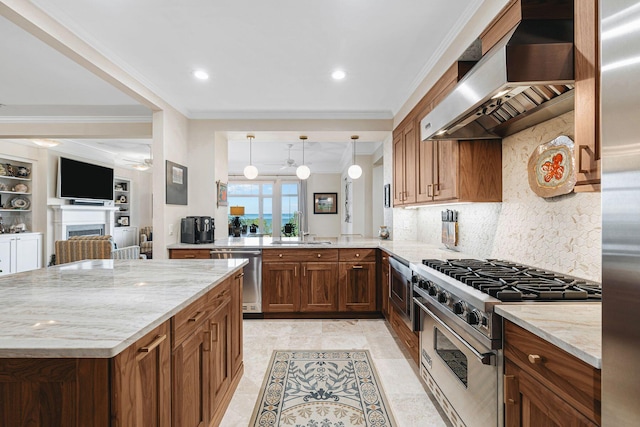 kitchen with appliances with stainless steel finishes, sink, light stone counters, kitchen peninsula, and wall chimney range hood