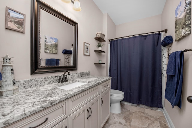 bathroom with vanity, toilet, and walk in shower