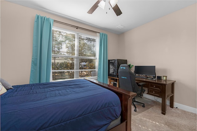 bedroom featuring light carpet and ceiling fan