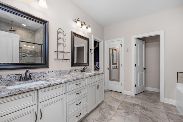 bathroom with vanity and independent shower and bath