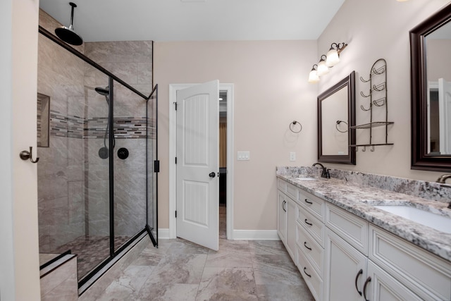 bathroom featuring vanity and an enclosed shower