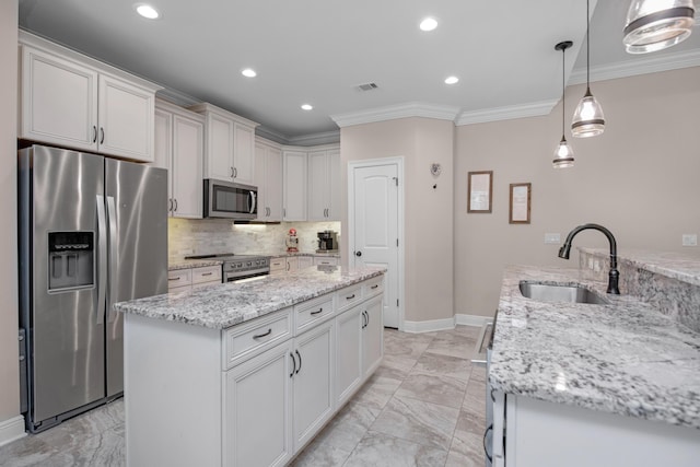 kitchen featuring sink, white cabinets, hanging light fixtures, light stone counters, and stainless steel appliances