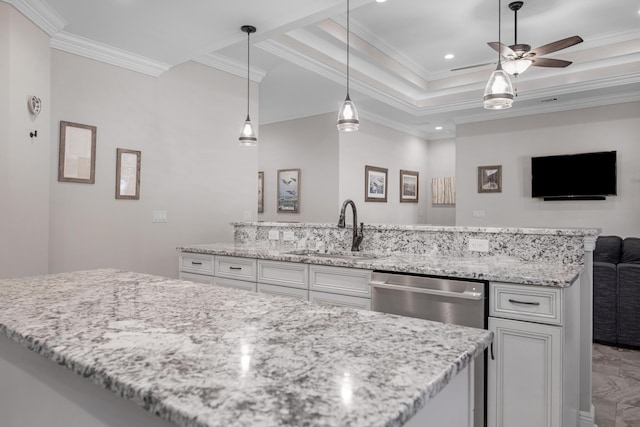 kitchen with sink, a tray ceiling, dishwasher, light stone countertops, and white cabinets