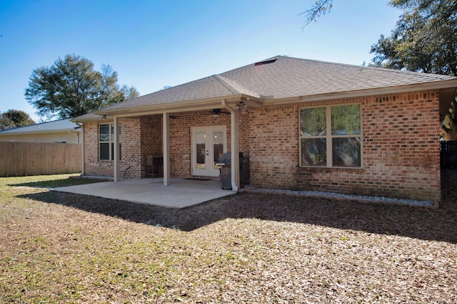 rear view of property featuring french doors and a patio area