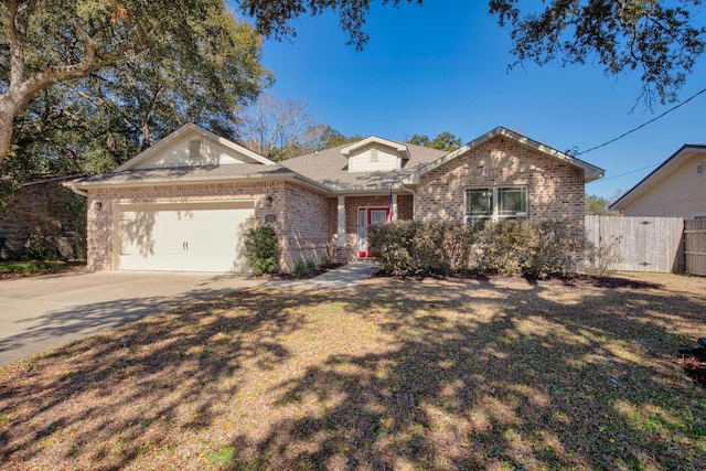 ranch-style home featuring a garage