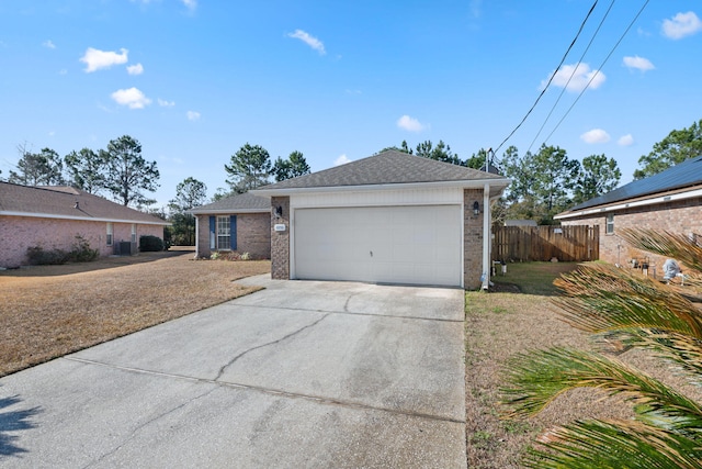 single story home with a garage and a front yard