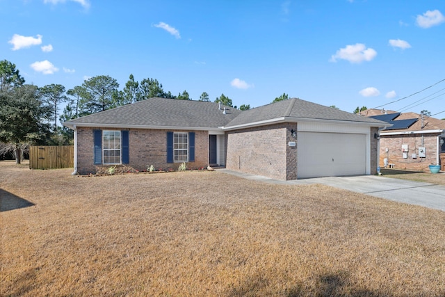 ranch-style home featuring a garage and a front yard