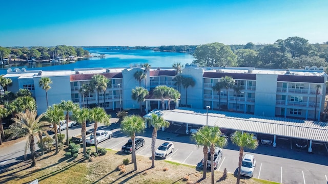 birds eye view of property featuring a water view