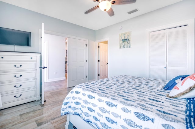 bedroom featuring a closet, ceiling fan, and light hardwood / wood-style flooring