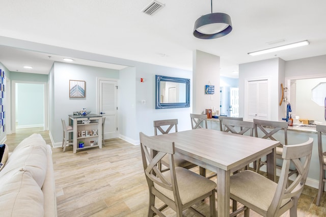 dining room featuring light hardwood / wood-style flooring