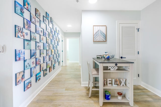 hall with light hardwood / wood-style floors