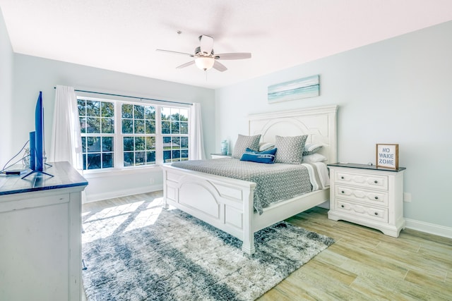 bedroom featuring ceiling fan and light hardwood / wood-style floors