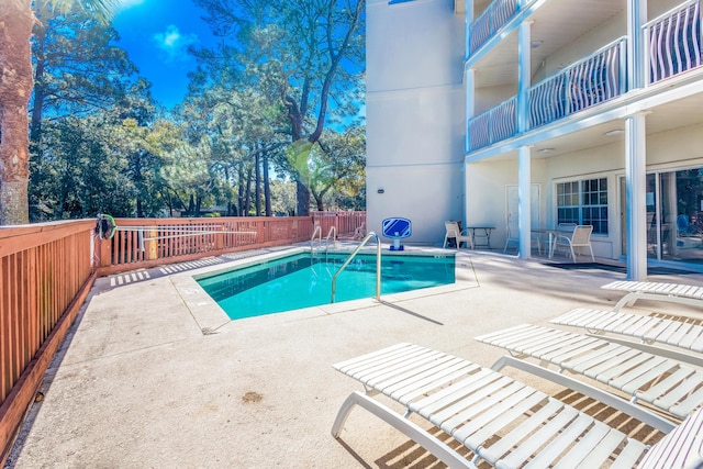 view of swimming pool with a patio