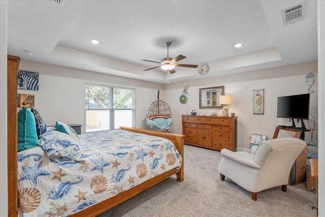1911 Ladybird Ln, Gulf Breeze, FL 32563 - bedroom featuring visible vents, light carpet, a ceiling fan, and a raised ceiling