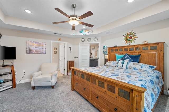 1911 Ladybird Ln, Gulf Breeze, FL 32563 - bedroom with visible vents, baseboards, ceiling fan, light carpet, and a tray ceiling